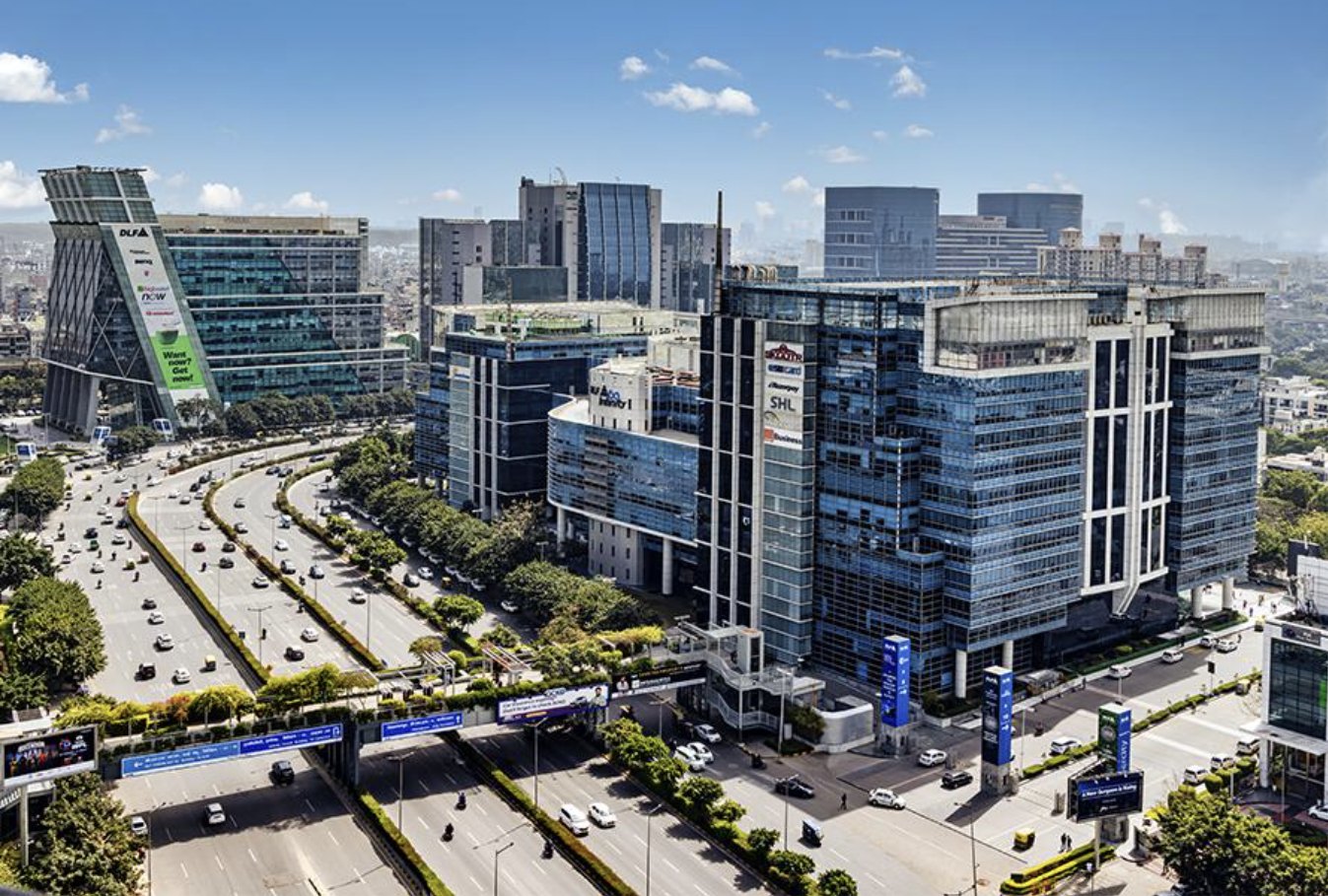 DLF Cyber City skyline in Gurugram, with glass office towers beside the expressway